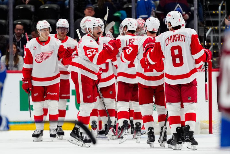 Feb 2, 2026; Denver, Colorado, USA; Members of the Detroit Red Wings celebrate defeating the Colorado Avalanche at Ball Arena. Mandatory Credit: Ron Chenoy-Imagn Images