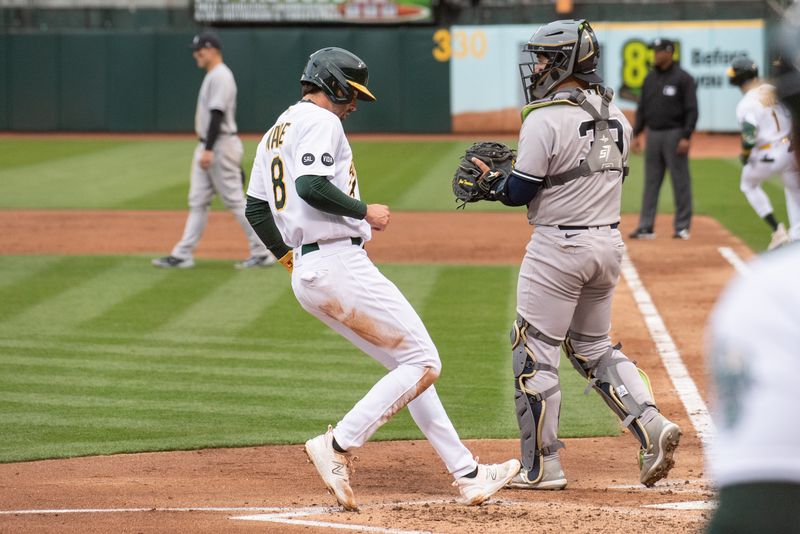 Jun 27, 2023; Oakland, California, USA; Oakland Athletics left fielder Tyler Wade (8) scores on a single by center fielder Esteury Ruiz (not pictured) during the third inning at Oakland-Alameda County Coliseum. Mandatory Credit: Ed Szczepanski-USA TODAY Sports