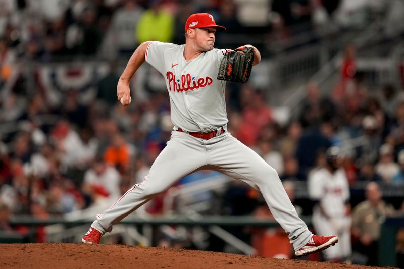 Oct 12, 2022; Atlanta, Georgia, USA; Philadelphia Phillies relief pitcher Andrew Bellatti (64) throws against the Atlanta Braves in the seventh inning during game two of the NLDS for the 2022 MLB Playoffs at Truist Park. Mandatory Credit: Dale Zanine-USA TODAY Sports