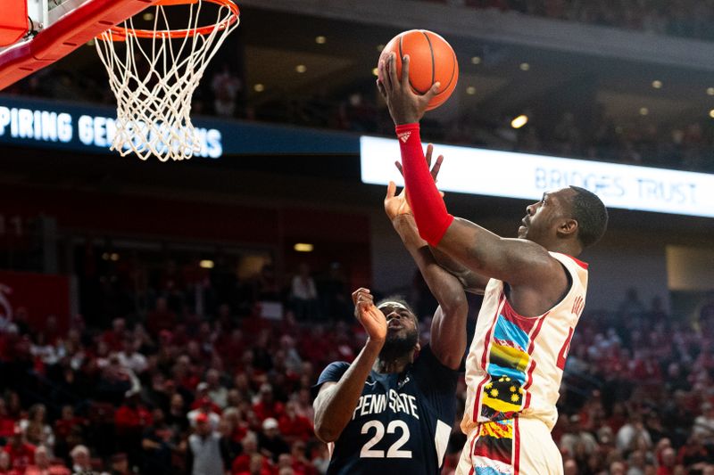 Feb 17, 2024; Lincoln, Nebraska, USA; Nebraska Cornhuskers forward Juwan Gary (4) shoots the ball against Penn State Nittany Lions forward Qudus Wahab (22) during the first half at Pinnacle Bank Arena. Mandatory Credit: Dylan Widger-USA TODAY Sports