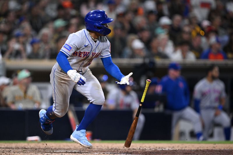 Jul 7, 2023; San Diego, California, USA; New York Mets shortstop Francisco Lindor (12) hits a single against the San Diego Padres during the ninth inning at Petco Park. Mandatory Credit: Orlando Ramirez-USA TODAY Sports