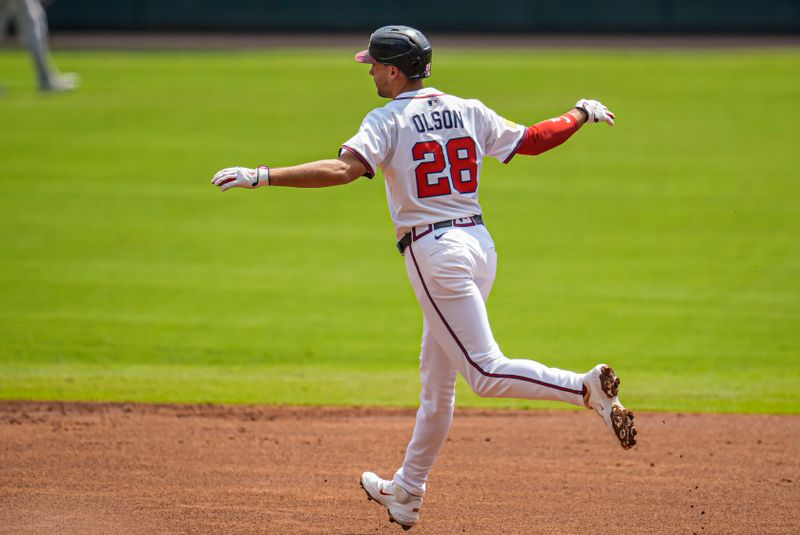 Sep 14, 2025; Cumberland, Georgia, USA; Atlanta Braves first baseman Matt Olson (28) reacts after hitting a home run against the Houston Astros during the first inning at Truist Park. Mandatory Credit: Dale Zanine-Imagn Images