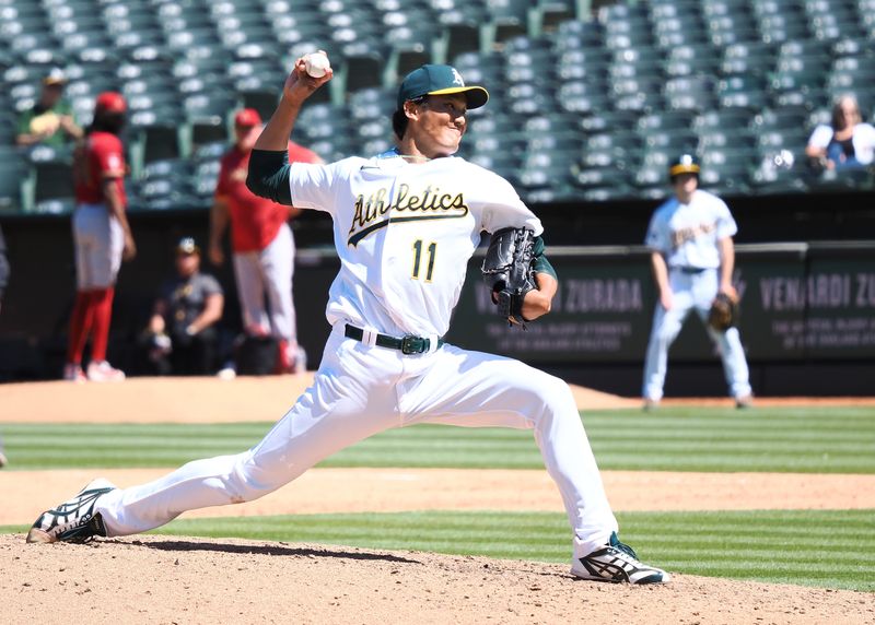 May 17, 2023; Oakland, California, USA; Oakland Athletics relief pitcher Shintaro Fujinami (11) pitches the ball against the Arizona Diamondbacks during the ninth inning at Oakland-Alameda County Coliseum. Mandatory Credit: Kelley L Cox-USA TODAY Sports