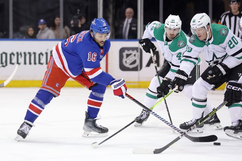 Feb 20, 2024; New York, New York, USA; New York Rangers center Vincent Trocheck (16) takes a shot against Dallas Stars defensemen Joel Hanley (44) and Ryan Suter (20) during the first period at Madison Square Garden. Mandatory Credit: Brad Penner-USA TODAY Sports