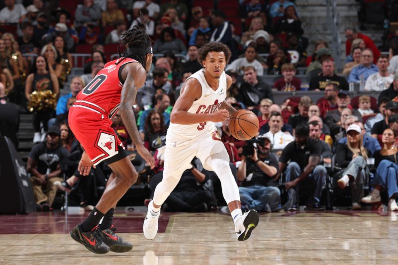 CLEVELAND, OH - OCTOBER 8: Craig Porter #9 of the Cleveland Cavaliers dribbles the ball during the game against the Chicago Bulls on October 8, 2024 at Rocket Mortgage FieldHouse in Cleveland, Ohio. NOTE TO USER: User expressly acknowledges and agrees that, by downloading and/or using this Photograph, user is consenting to the terms and conditions of the Getty Images License Agreement. Mandatory Copyright Notice: Copyright 2024 NBAE (Photo by Jeff Haynes/NBAE via Getty Images)