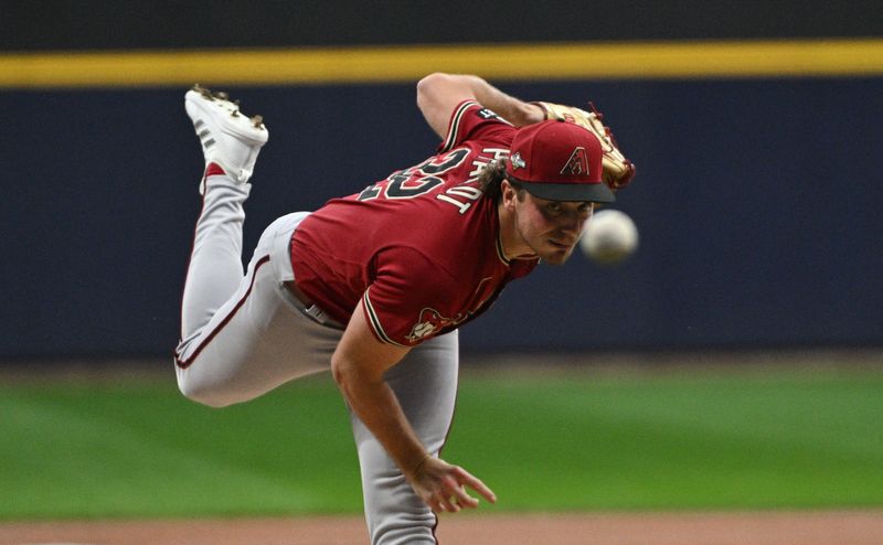 Oct 3, 2023; Milwaukee, Wisconsin, USA; Arizona Diamondbacks starting pitcher Brandon Pfaadt (32) delivers a pitch against the Milwaukee Brewers in the first inning during game one of the Wildcard series for the 2023 MLB playoffs at American Family Field. Mandatory Credit: Michael McLoone-USA TODAY Sports