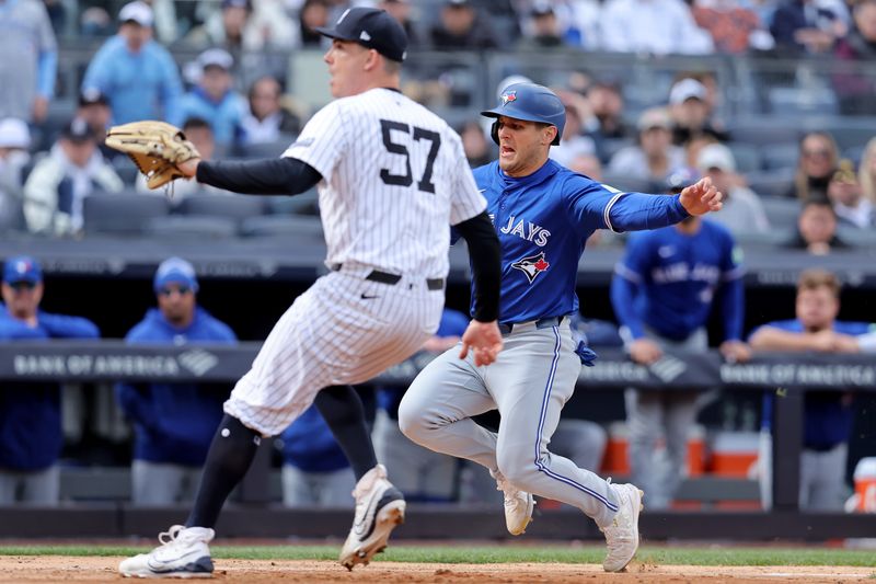 Apr 5, 2024; Bronx, New York, USA; Toronto Blue Jays left fielder Daulton Varsho (25) scores on a wild pitch by New York Yankees relief pitcher Nick Burdi (57) during the ninth inning at Yankee Stadium. Mandatory Credit: Brad Penner-USA TODAY Sports