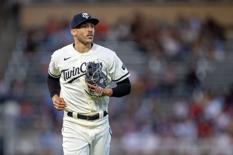 May 10, 2023; Minneapolis, Minnesota, USA; Minnesota Twins shortstop Carlos Correa (4) runs off the field after the seventh inning against the San Diego Padres at Target Field. Mandatory Credit: Jesse Johnson-USA TODAY Sports