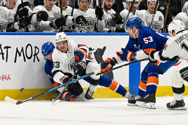 Mar 13, 2026; Elmont, New York, USA; Los Angeles Kings right wing Jared Wright (53) plays the puck from the ice after a hit by New York Islanders left wing Emil Heineman (51) during the first period at UBS Arena. Mandatory Credit: Dennis Schneidler-Imagn Images Mar 13, 2026; Elmont, New York, USA; Los Angeles Kings right wing Jared Wright (53) plays the puck from the ice after a hit by New York Islanders left wing Emil Heineman (51) during the first period at UBS Arena. Mandatory Credit: Dennis Schneidler-Imagn Images