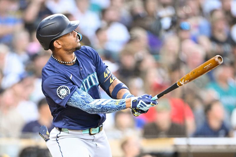 Jun 9, 2024; San Diego, California, USA; Seattle Mariners center fielder Julio Rodriguez (44) hits a solo home run during the fifth inning against the San Diego Padres at Petco Park. Mandatory Credit: Denis Poroy-USA TODAY Sports at Petco Park. 