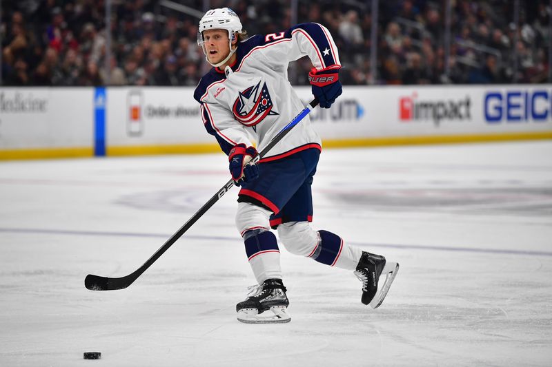 Mar 16, 2023; Los Angeles, California, USA; Columbus Blue Jackets defenseman Adam Boqvist (27) passes the puck against the Los Angeles Kings during the third period at Crypto.com Arena. Mandatory Credit: Gary A. Vasquez-USA TODAY Sports