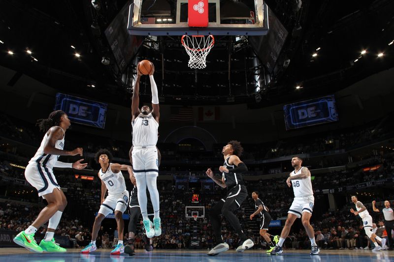 MEMPHIS, TN - OCTOBER 30: Jaren Jackson Jr. #13 of the Memphis Grizzlies rebounds the ball during the game against the Brooklyn Nets on October 30, 2024 at FedExForum in Memphis, Tennessee. NOTE TO USER: User expressly acknowledges and agrees that, by downloading and or using this photograph, User is consenting to the terms and conditions of the Getty Images License Agreement. Mandatory Copyright Notice: Copyright 2024 NBAE (Photo by Joe Murphy/NBAE via Getty Images)