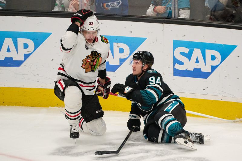 Mar 23, 2024; San Jose, California, USA; Chicago Blackhawks defenseman Nikita Zaitsev (22) and San Jose Sharks left wing Alexander Barabanov (94) react after colliding during the third period at SAP Center at San Jose. Mandatory Credit: Robert Edwards-USA TODAY Sports