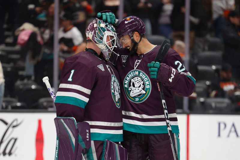 Oct 15, 2023; Anaheim, California, USA; Anaheim Ducks goalie John Gibson (36) embraces Anaheim Ducks center Bo Groulx (24) after a game at Honda Center. Mandatory Credit: Yannick Peterhans-USA TODAY Sports