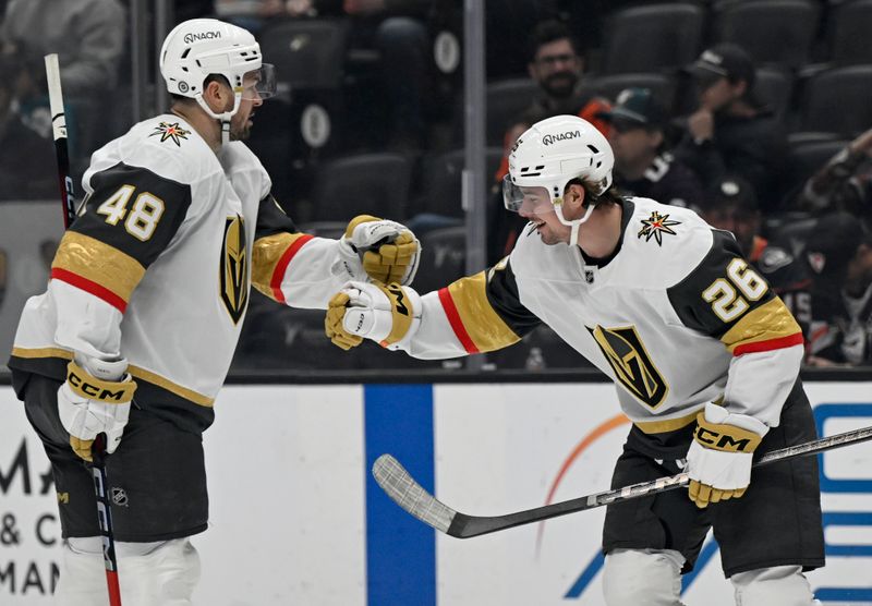 Dec 4, 2024; Anaheim, California, USA;  Vegas Golden Knights right wing Alexander Holtz (26) celebrates scoring a goal with center Tomas Hertl (48) against the Anaheim Ducks during the third period at Honda Center. Mandatory Credit: Alex Gallardo-Imagn Images