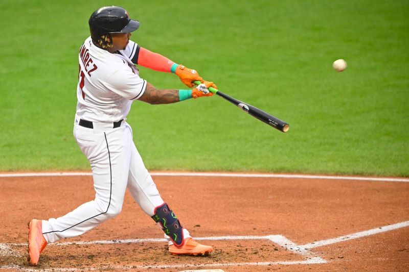 Jun 8, 2023; Cleveland, Ohio, USA; Cleveland Guardians third baseman Jose Ramirez (11) hits a two-run home run in the third inning against the Boston Red Sox at Progressive Field. Mandatory Credit: David Richard-USA TODAY Sports