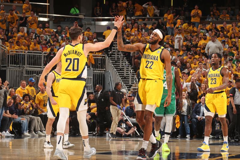 INDIANAPOLIS, IN - MAY 27: Doug McDermott #20 high fives Isaiah Jackson #22 of the Indiana Pacers during the game against the Boston Celtics during Game 4 of the Eastern Conference Finals of the 2024 NBA Playoffs on May 27, 2024 at Gainbridge Fieldhouse in Indianapolis, Indiana. NOTE TO USER: User expressly acknowledges and agrees that, by downloading and or using this Photograph, user is consenting to the terms and conditions of the Getty Images License Agreement. Mandatory Copyright Notice: Copyright 2024 NBAE (Photo by Nathaniel S. Butler/NBAE via Getty Images)