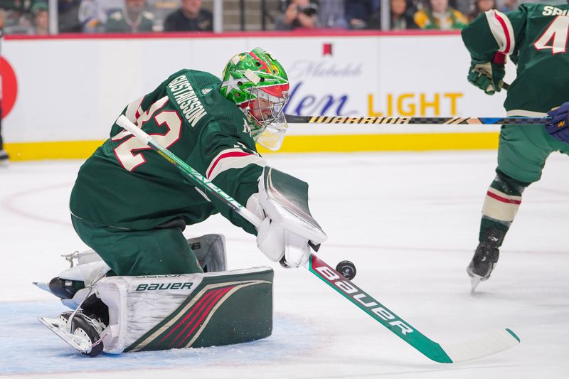 Nov 28, 2023; Saint Paul, Minnesota, USA; Minnesota Wild goaltender Filip Gustavsson (32) makes a save against the St. Louis Blues in the first period at Xcel Energy Center. Mandatory Credit: Brad Rempel-USA TODAY Sports