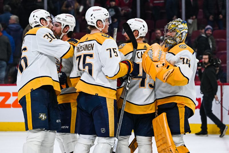 Dec 10, 2023; Montreal, Quebec, CAN; Nashville Predators players gather around goalie Juuse Saros (74) to celebrate the win against the Montreal Canadiens after the third period at Bell Centre. Mandatory Credit: David Kirouac-USA TODAY Sports