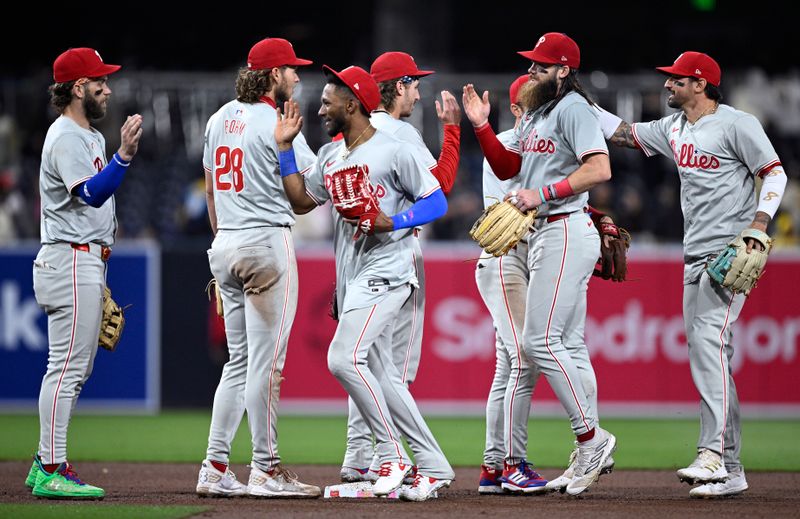 Apr 26, 2024; San Diego, California, USA; Philadelphia Phillies players celebrate on the field after defeating the San Diego Padres at Petco Park. Mandatory Credit: Orlando Ramirez-USA TODAY Sports