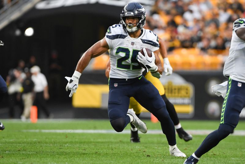 Seattle Seahawks running back Travis Homer (25) runs away from Pittsburgh Steelers linebacker Derrek Tuszka (48) during the first half of an NFL preseason football game, Saturday, Aug. 13, 2022, in Pittsburgh. (AP Photo/Barry Reeger)