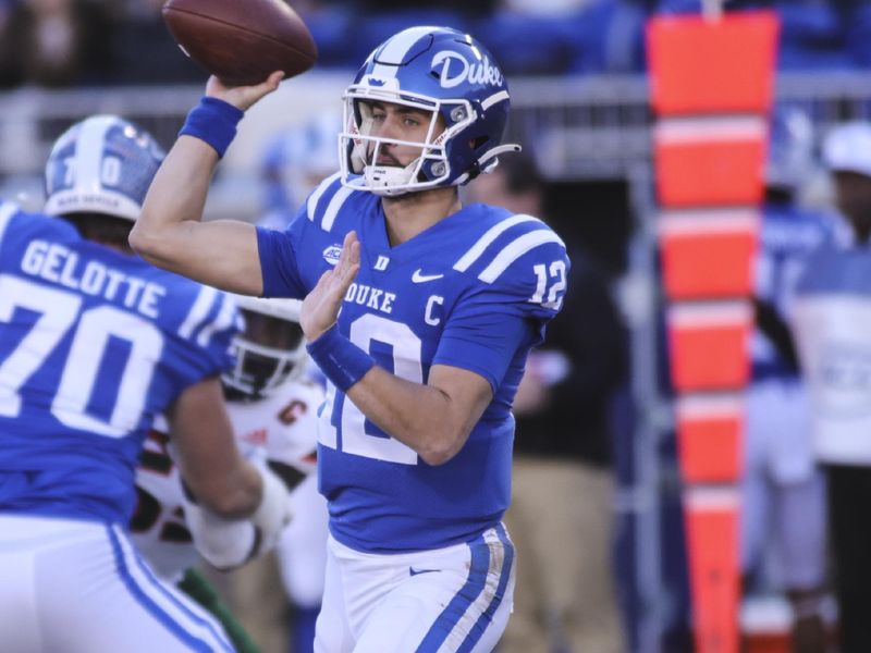 Nov 27, 2021; Durham, North Carolina, USA; Duke Blue Devils quarterback Gunnar Holmberg (12) with the ball during the second half of the game against the Miami Hurricanes at Wallace Wade Stadium. at Wallace Wade Stadium. Mandatory Credit: Jaylynn Nash-USA TODAY Sports