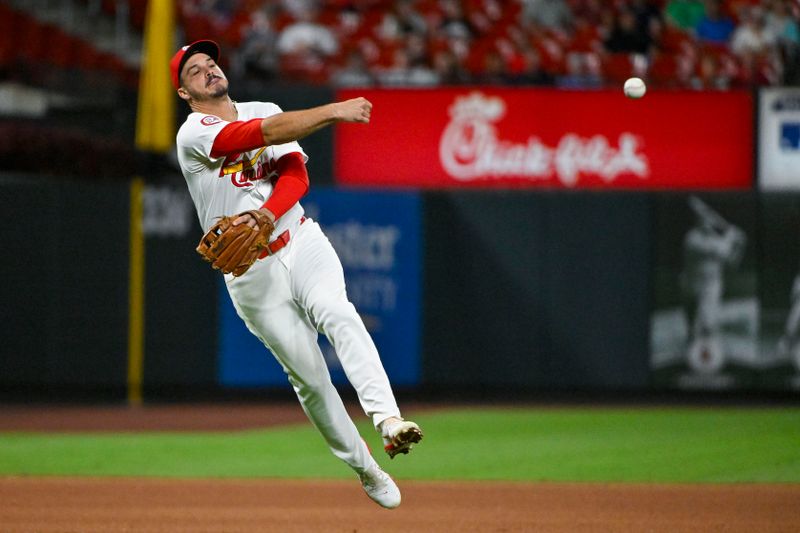 Aug 20, 2024; St. Louis, Missouri, USA;  St. Louis Cardinals third baseman Nolan Arenado (28) throws on the run against the Milwaukee Brewers during the seventh inning and at Busch Stadium. Mandatory Credit: Jeff Curry-USA TODAY Sports