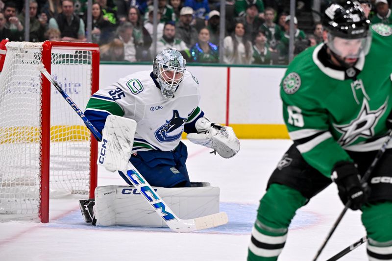 Jan 31, 2025; Dallas, Texas, USA; Vancouver Canucks goaltender Thatcher Demko (35) faces the Dallas Stars attack during the second period at the American Airlines Center. Mandatory Credit: Jerome Miron-Imagn Images