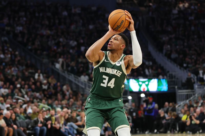 MILWAUKEE, WISCONSIN - DECEMBER 21: Giannis Antetokounmpo #34 of the Milwaukee Bucks takes a shot during a game against the Orlando Magic at Fiserv Forum on December 21, 2023 in Milwaukee, Wisconsin. NOTE TO USER: User expressly acknowledges and agrees that, by downloading and or using this photograph, User is consenting to the terms and conditions of the Getty Images License Agreement. (Photo by Stacy Revere/Getty Images)