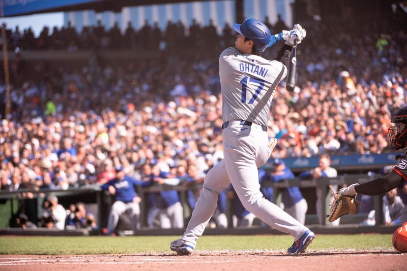 Jun 29, 2024; San Francisco, California, USA; Los Angeles Dodgers two-way player Shohei Ohtani (17) hits a home run during the third inning against the San Francisco Giants at Oracle Park. Mandatory Credit: Ed Szczepanski-USA TODAY Sports