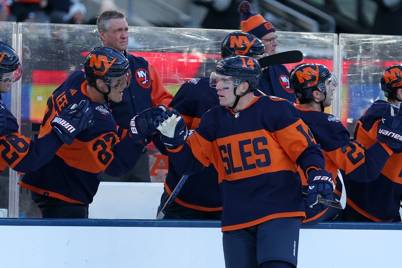 Feb 18, 2024; East Rutherford, New Jersey, USA; New York Islanders center Bo Horvat (14) celebrates his goal against the New York Rangers with teammates during the first period of a Stadium Series ice hockey game at MetLife Stadium. Mandatory Credit: Brad Penner-USA TODAY Sports