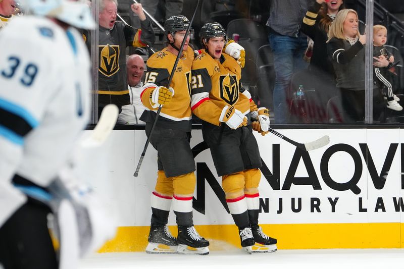 Nov 2, 2024; Las Vegas, Nevada, USA; Vegas Golden Knights center Brett Howden (21) celebrates with defenseman Noah Hanifin (15) after scoring a goal against the Utah Hockey Club in overtime to give the Golden Knights as 4-3 victory at T-Mobile Arena. Mandatory Credit: Stephen R. Sylvanie-Imagn Images