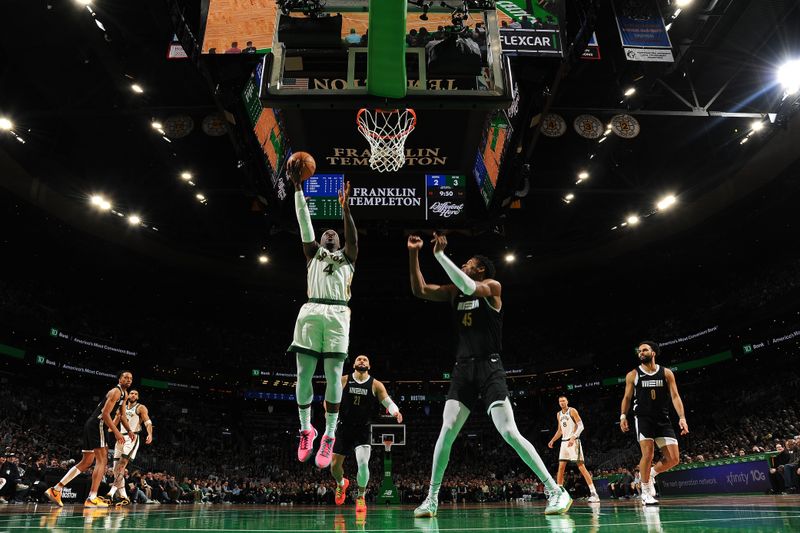 BOSTON, MA - FEBRUARY 4: Jrue Holiday #4 of the Boston Celtics drives to the basket during the game  against the Memphis Grizzlies  on February 4, 2024 at the TD Garden in Boston, Massachusetts. NOTE TO USER: User expressly acknowledges and agrees that, by downloading and or using this photograph, User is consenting to the terms and conditions of the Getty Images License Agreement. Mandatory Copyright Notice: Copyright 2024 NBAE  (Photo by Brian Babineau/NBAE via Getty Images)