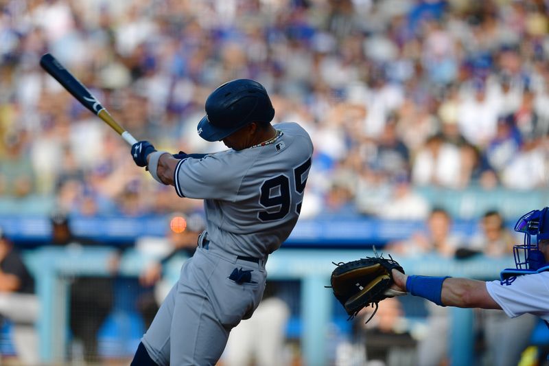 Jun 4, 2023; Los Angeles, California, USA; New York Yankees left fielder Oswaldo Cabrera (95) hits a ground out RBI against the Los Angeles Dodgers during the eighth inning at Dodger Stadium. Mandatory Credit: Gary A. Vasquez-USA TODAY Sports