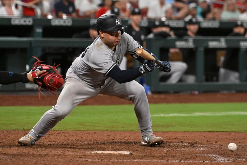 Jul 1, 2023; St. Louis, Missouri, USA; New York Yankees catcher Jose Trevino (39) bunts in a run against the St. Louis Cardinals in the eighth inning in game two of a double header at Busch Stadium. Mandatory Credit: Joe Puetz-USA TODAY Sports