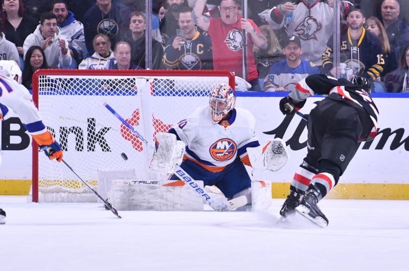 Oct 21, 2023; Buffalo, New York, USA; New York Islanders goaltender Semyon Varlamov (40) deflects a shot by Buffalo Sabres center Dylan Cozens (24) in the first period at KeyBank Center. Mandatory Credit: Mark Konezny-USA TODAY Sports