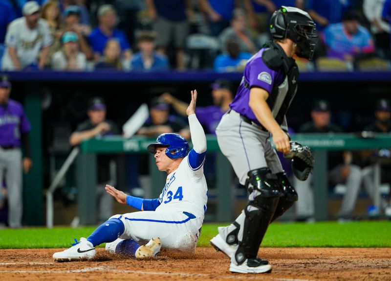 Apr 22, 2025; Kansas City, Missouri, USA; Kansas City Royals catcher Freddy Fermin (34) scores a run against Colorado Rockies catcher Braxton Fulford (37) during the ninth inning at Kauffman Stadium. Mandatory Credit: Jay Biggerstaff-Imagn Images