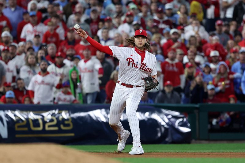 Oct 24, 2023; Philadelphia, Pennsylvania, USA; Philadelphia Phillies first baseman Alec Bohm (28) makes a throw to first base against the Arizona Diamondbacks in the sixth inning for game seven of the NLCS for the 2023 MLB playoffs at Citizens Bank Park. Mandatory Credit: Bill Streicher-USA TODAY Sports