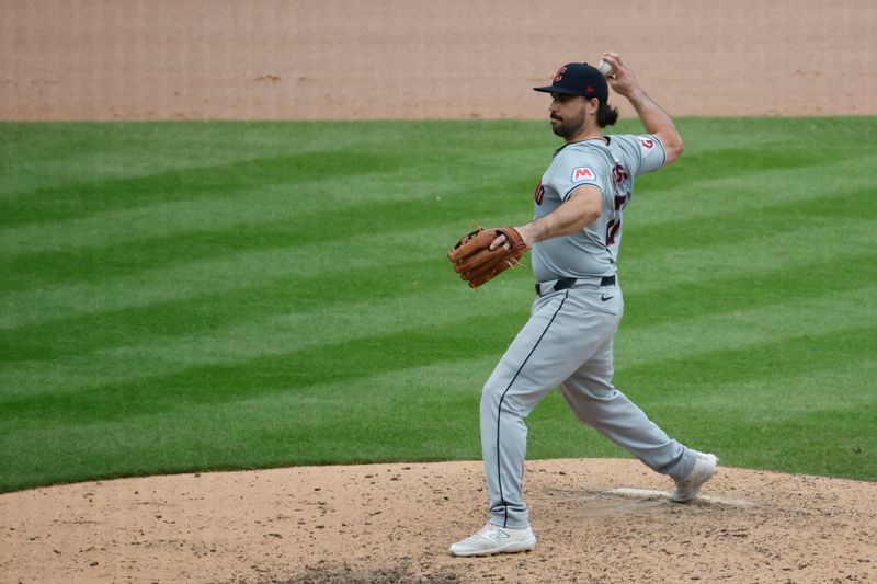 Jul 11, 2024; Detroit, Michigan, USA;  Cleveland Guardians catcher Austin Hedges (27) pitches in the eighth inning against the Detroit Tigers at Comerica Park. Mandatory Credit: Rick Osentoski-USA TODAY Sports