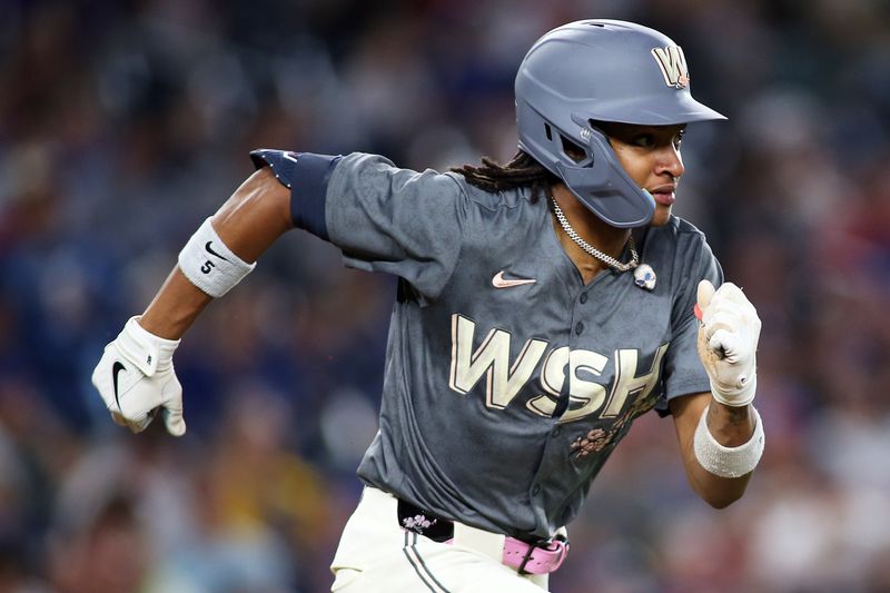 Aug 30, 2024; Washington, District of Columbia, USA; Washington Nationals shortstop CJ Abrams (5) grounds into a double play during the seventh inning against the Chicago Cubs at Nationals Park. Mandatory Credit: Daniel Kucin Jr.-USA TODAY Sports

