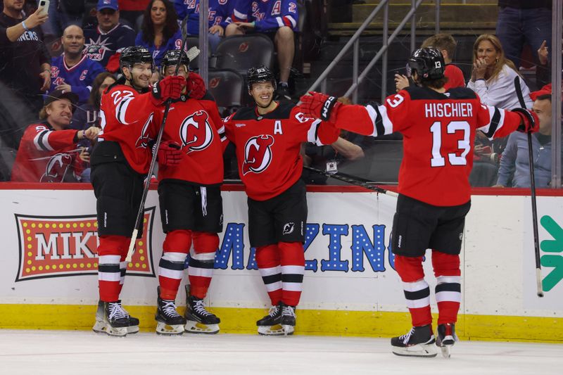 Apr 5, 2025; Newark, New Jersey, USA; New Jersey Devils left wing Jesper Bratt (63) celebrates his goal against the New York Rangers during the second period at Prudential Center. Mandatory Credit: Ed Mulholland-Imagn Images