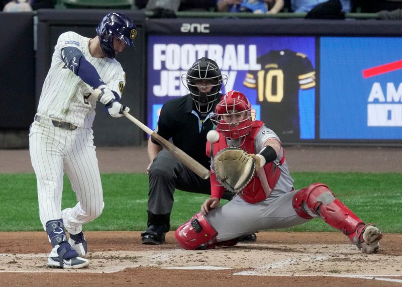 Apr 6, 2025; Milwaukee, Wisconsin, USA; Milwaukee Brewers second base Brice Turang (2) hits an RBI double during the third inning of their game against the Cincinnati Reds at American Family Field. Mandatory Credit: Mark Hoffman-USA Today Network via Imagn Images 