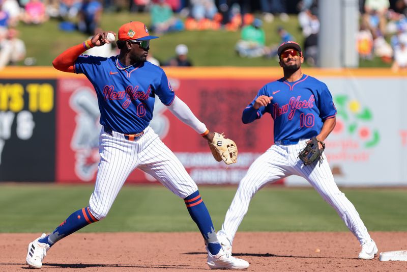 Feb 24, 2026; Port St. Lucie, Florida, USA; New York Mets shortstop Ronny Mauricio (0) throws to first  base against the Houston Astros during the third inning at Clover Park. Mandatory Credit: Sam Navarro-Imagn Images