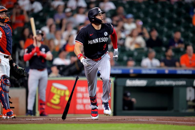 Jun 2, 2024; Houston, Texas, USA; Minnesota Twins left fielder Trevor Larnach (9) hits a home run against the Houston Astros during the first inning at Minute Maid Park. Mandatory Credit: Erik Williams-USA TODAY Sports