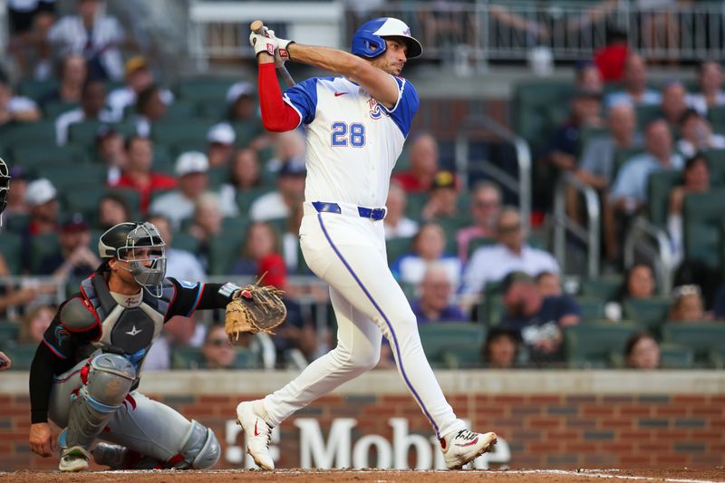 Aug 3, 2024; Atlanta, Georgia, USA; Atlanta Braves first baseman Matt Olson (28) hits a single against the Miami Marlins in the third inning at Truist Park. Mandatory Credit: Brett Davis-USA TODAY Sports
