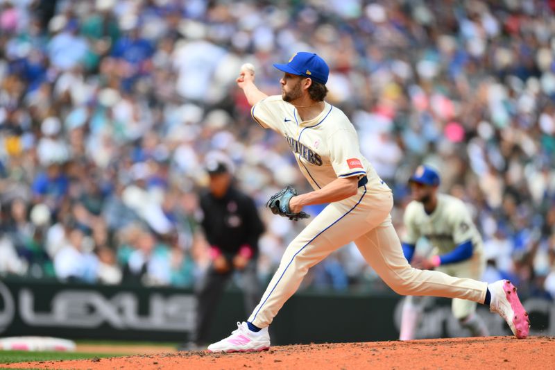 May 11, 2025; Seattle, Washington, USA; Seattle Mariners relief pitcher Collin Snider (52) pitches to the Toronto Blue Jays during the sixth inning at T-Mobile Park. Mandatory Credit: Steven Bisig-Imagn Images