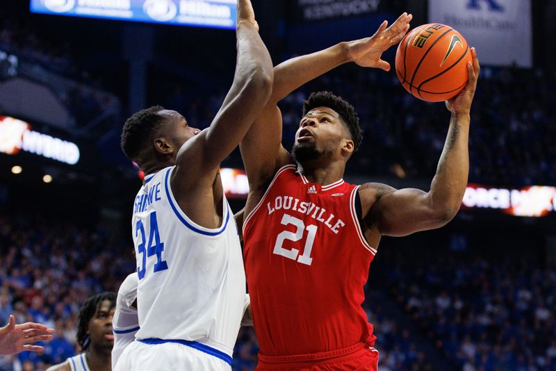 Dec 31, 2022; Lexington, Kentucky, USA; Louisville Cardinals forward Sydney Curry (21) goes to the basket against Kentucky Wildcats forward Oscar Tshiebwe (34) during the first half at Rupp Arena at Central Bank Center. Mandatory Credit: Jordan Prather-USA TODAY Sports