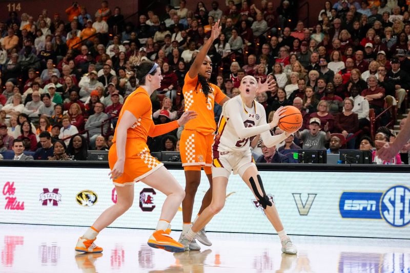 Mar 9, 2024; Greensville, SC, USA; South Carolina Gamecocks forward Chloe Kitts (21) looks for a teammate guarded by Tennessee Lady Vols guard Kaiya Wynn (5) and guard Sara Puckett (1) during the second half at Bon Secours Wellness Arena. Mandatory Credit: Jim Dedmon-USA TODAY Sports