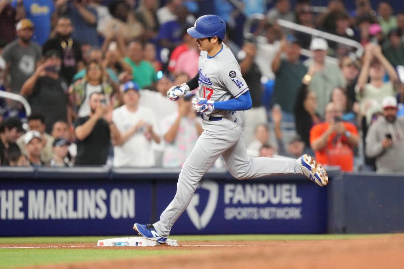 May 6, 2025; Miami, Florida, USA;  Los Angeles Dodgers designated hitter Shohei Ohtani (17) rounds third base after hitting a home run against the Miami Marlins in the sixth inning at loanDepot Park. Mandatory Credit: Jim Rassol-Imagn Images