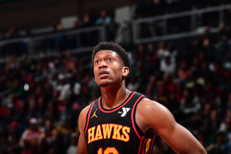 ATLANTA, GA - MARCH 28: De'Andre Hunter #12 of the Atlanta Hawks looks on during the game against the Boston Celtics on March 28, 2024 at State Farm Arena in Atlanta, Georgia.  NOTE TO USER: User expressly acknowledges and agrees that, by downloading and/or using this Photograph, user is consenting to the terms and conditions of the Getty Images License Agreement. Mandatory Copyright Notice: Copyright 2024 NBAE (Photo by Scott Cunningham/NBAE via Getty Images)